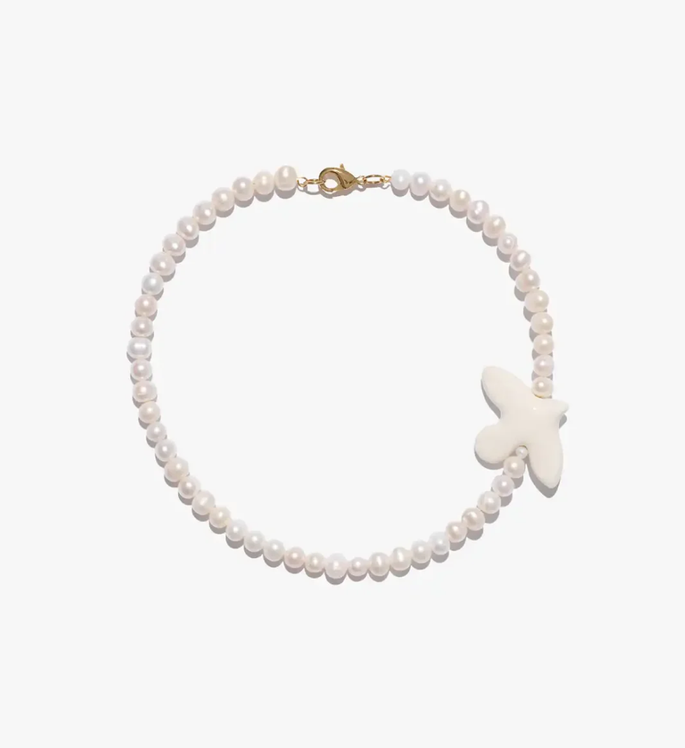 TSVITE TEREN MYRNI necklace with medium pearls and a bird in golden